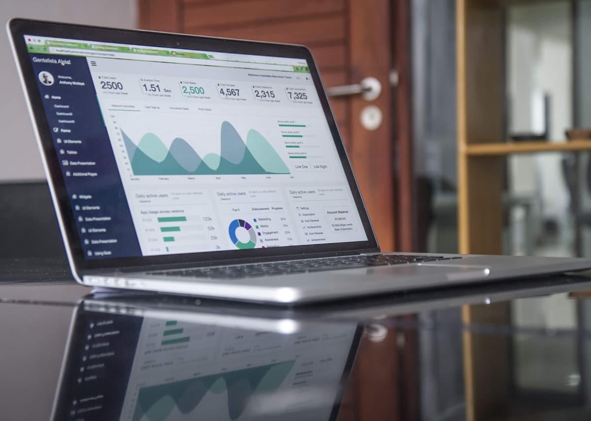 Product team reviewing a multi-tenant SaaS dashboard on a large display